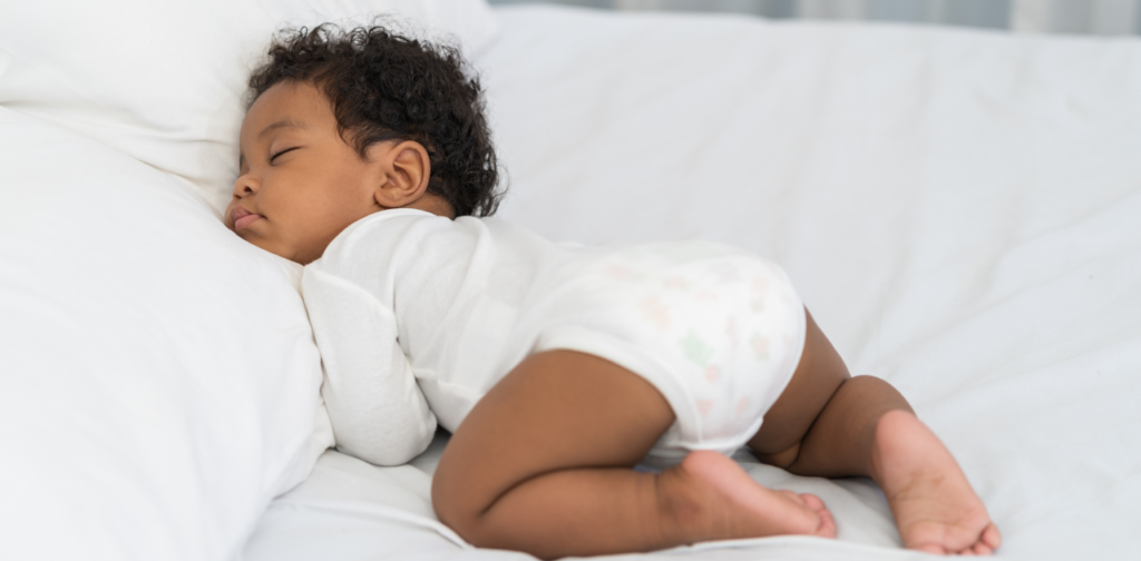 Why do babies sleep with their butts up?